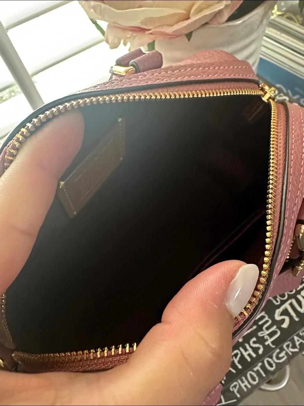 Coach mini Rowan signature leather in the color peony